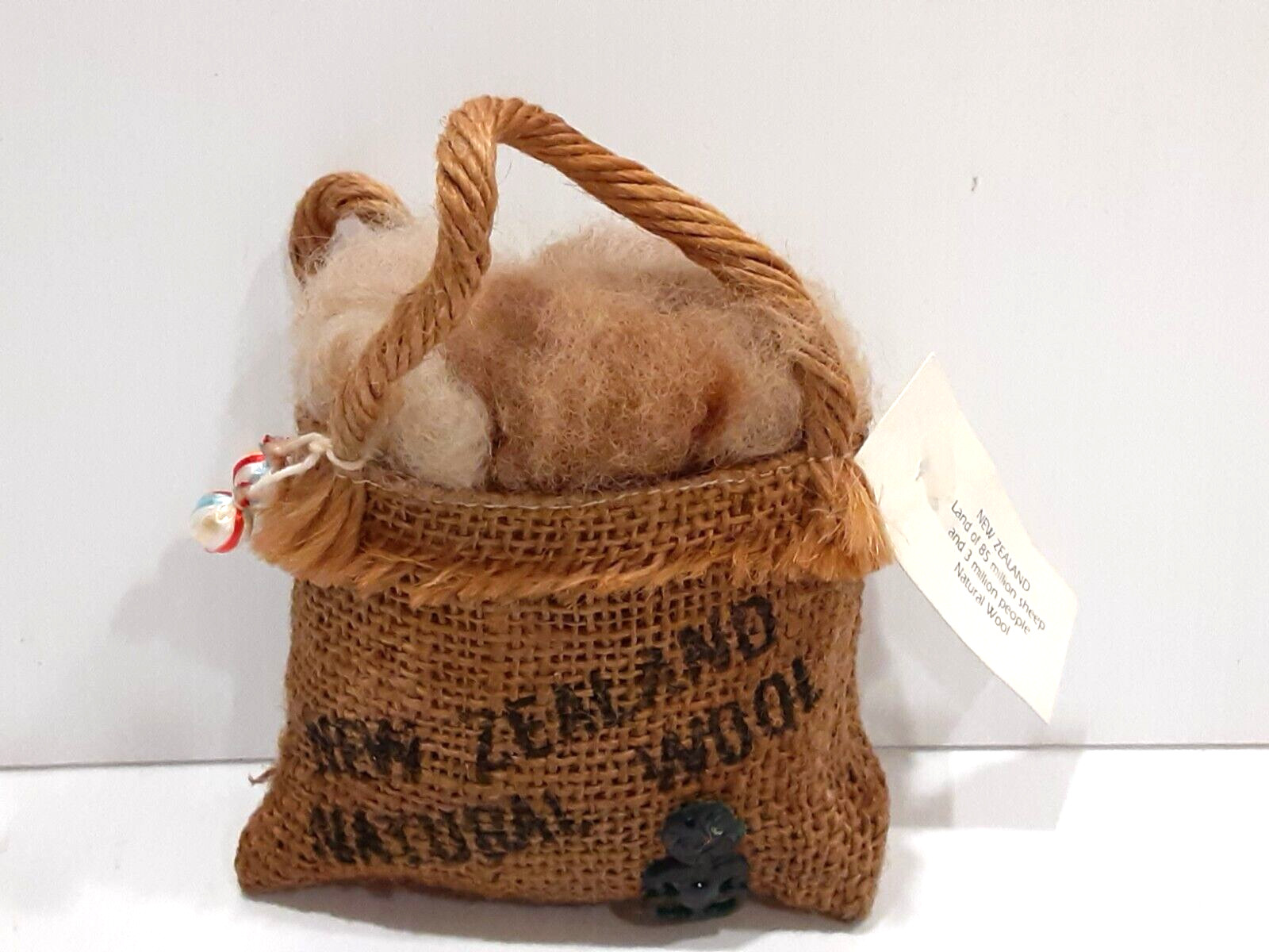 New Zealand Natural Wool in a Burlap Bag 4″ H x 4″ L from Gift Shop